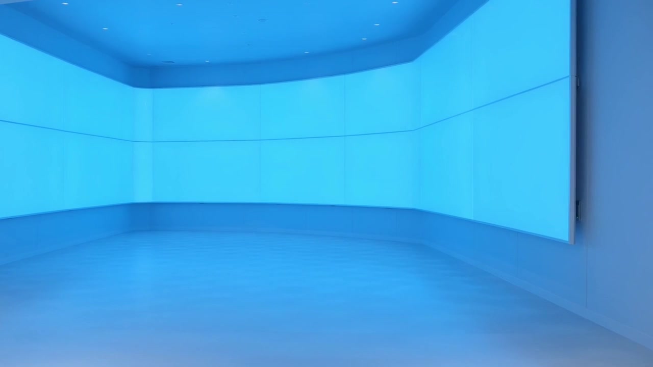 Futuristic Empty Room with Large Curved Blue Display Screen