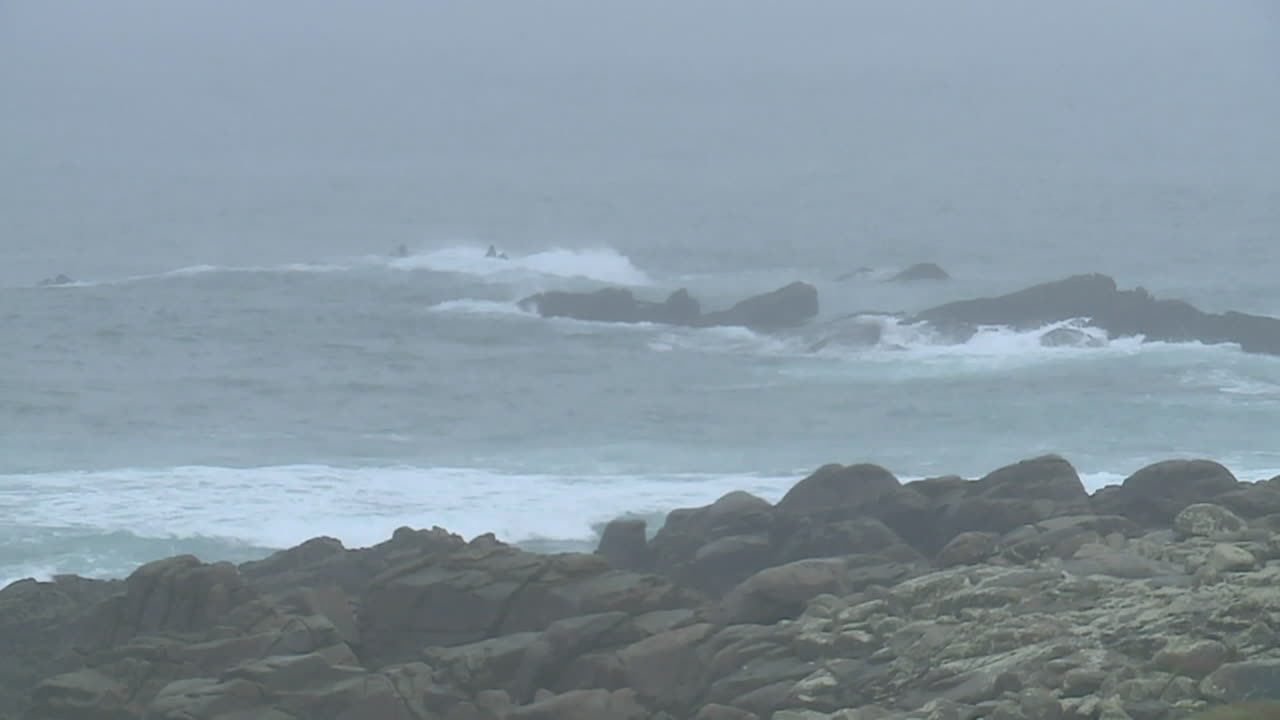 Rocky Coastline in Foggy Weather