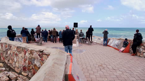 tourists do land-based whale watching in hermanus from gearing's point