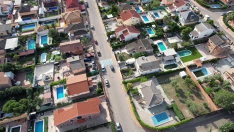 Car-passing-through-a-Neighborhood-with-many-Swimming-Pools-Madrid