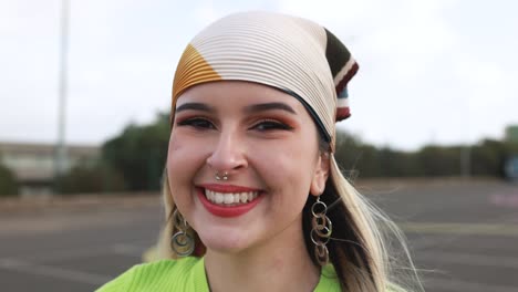 happy young girl smiling on camera outdoor