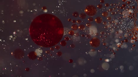 abstractas esferas líquidas rojas brillantes de sangre que se forman juntas en una textura de fondo de bokeh líquido