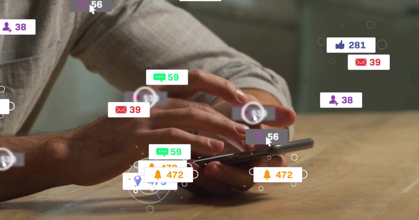 Mid-adult male tapping smartphone and generating social media icons for engagement