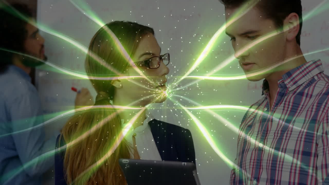 Businesswoman holding tablet collaborating with male by whiteboard, showing green tech overlay