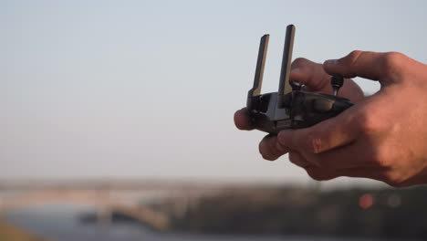 person controlling a drone