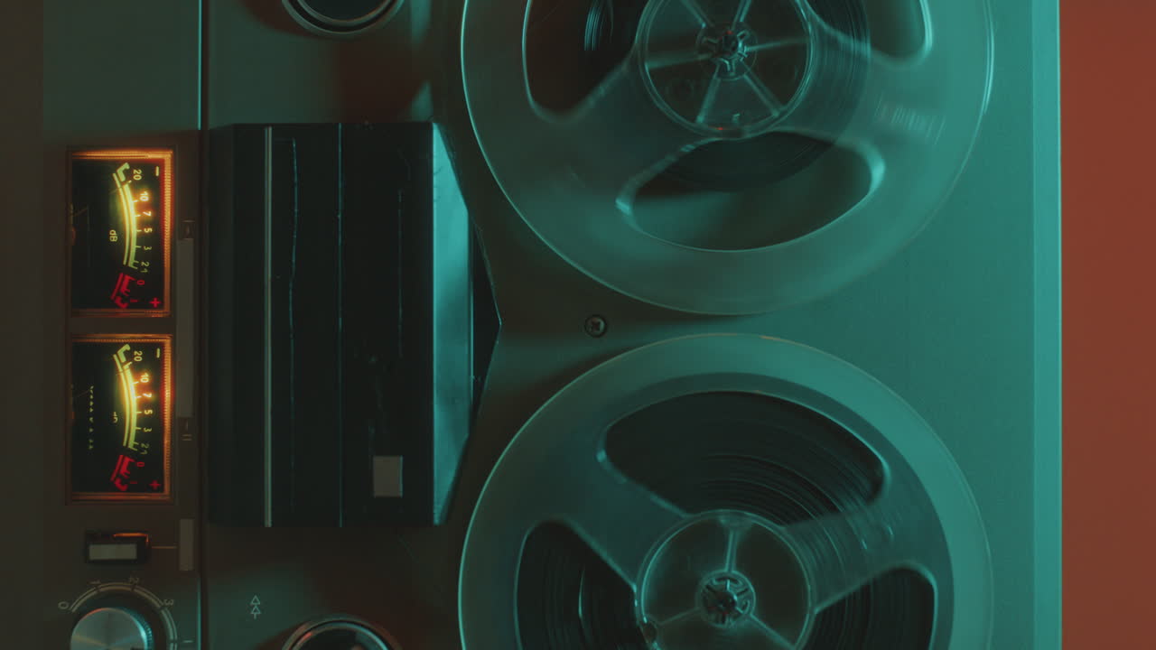 Vintage Reel-to-Reel Tape Recorder in Colorful Neon Illumination