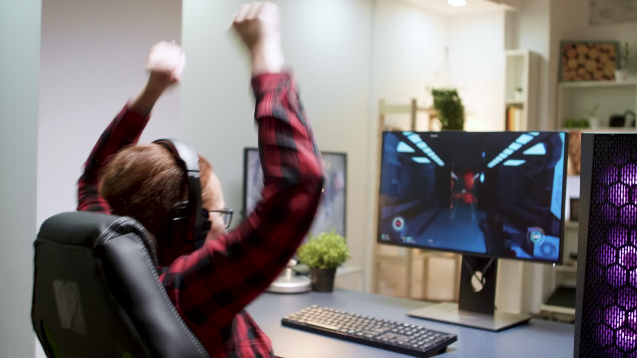 Woman playing video games on computer