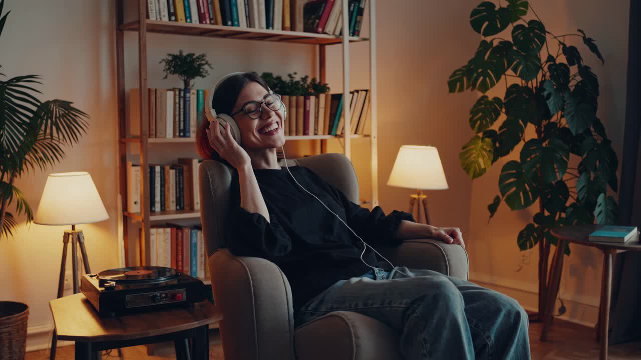 Cozy living room scene with a person enjoying music on headphones