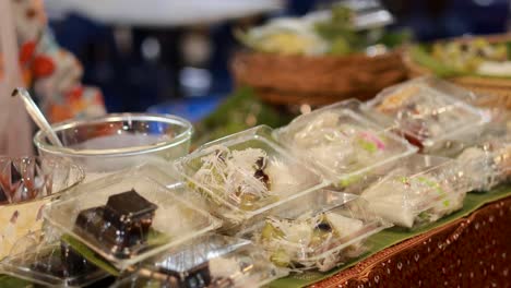 assorted packaged foods displayed at a market stall