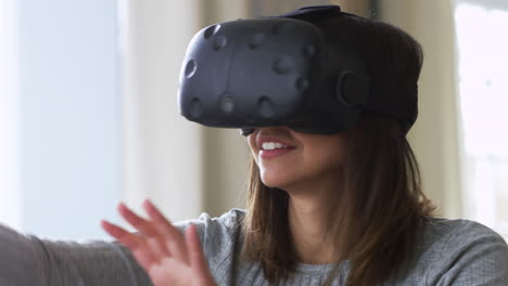 woman at home wearing virtual reality headset shot on r3d