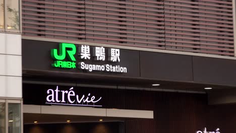 tokyo, japan - 8th oct. 2018 : jr sugamo station, north exit, 4k, people come and go in the afternoon, zoom in, camera fixed, angle neutral view.