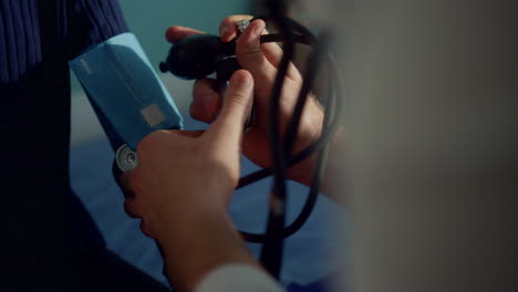 doctor hands preparing tonometer to measure pressure child patient close up.