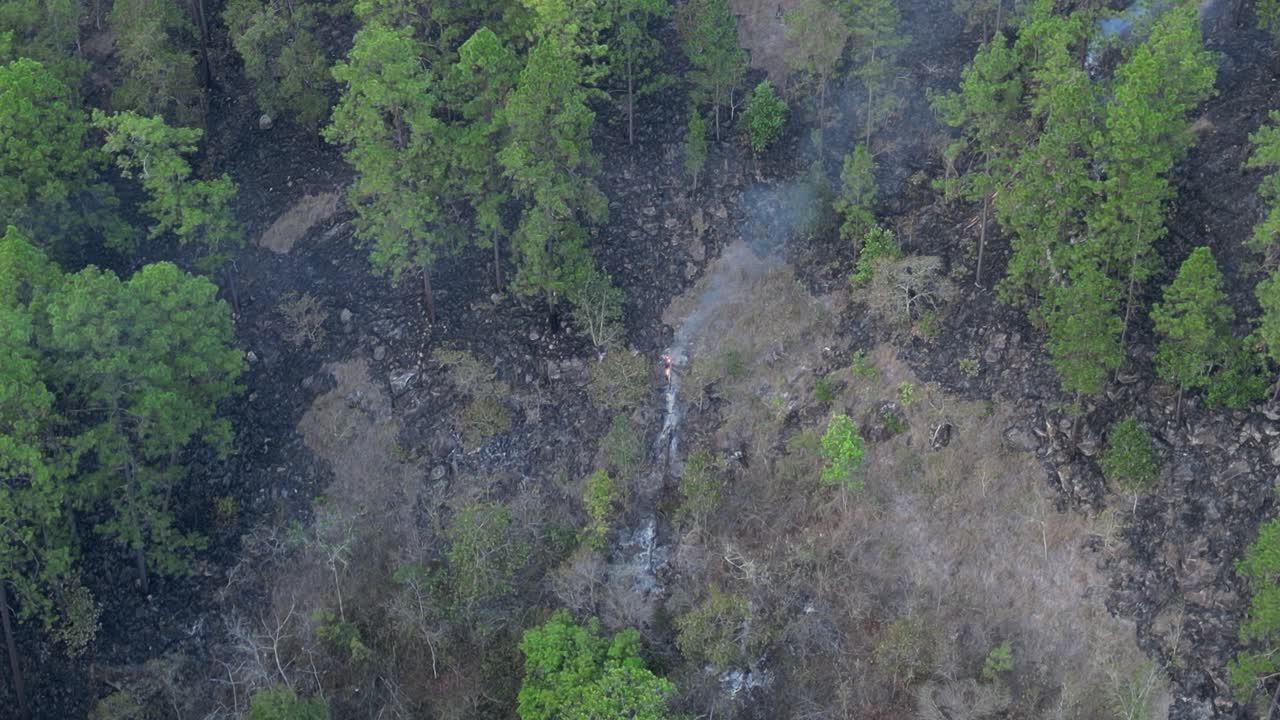 Deforested landscape from wildfire in Honduras, aerial drone view over burned forest