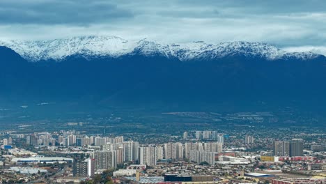 urban skyline meets the snowy andes in this breathtaking high-altitude city panorama.