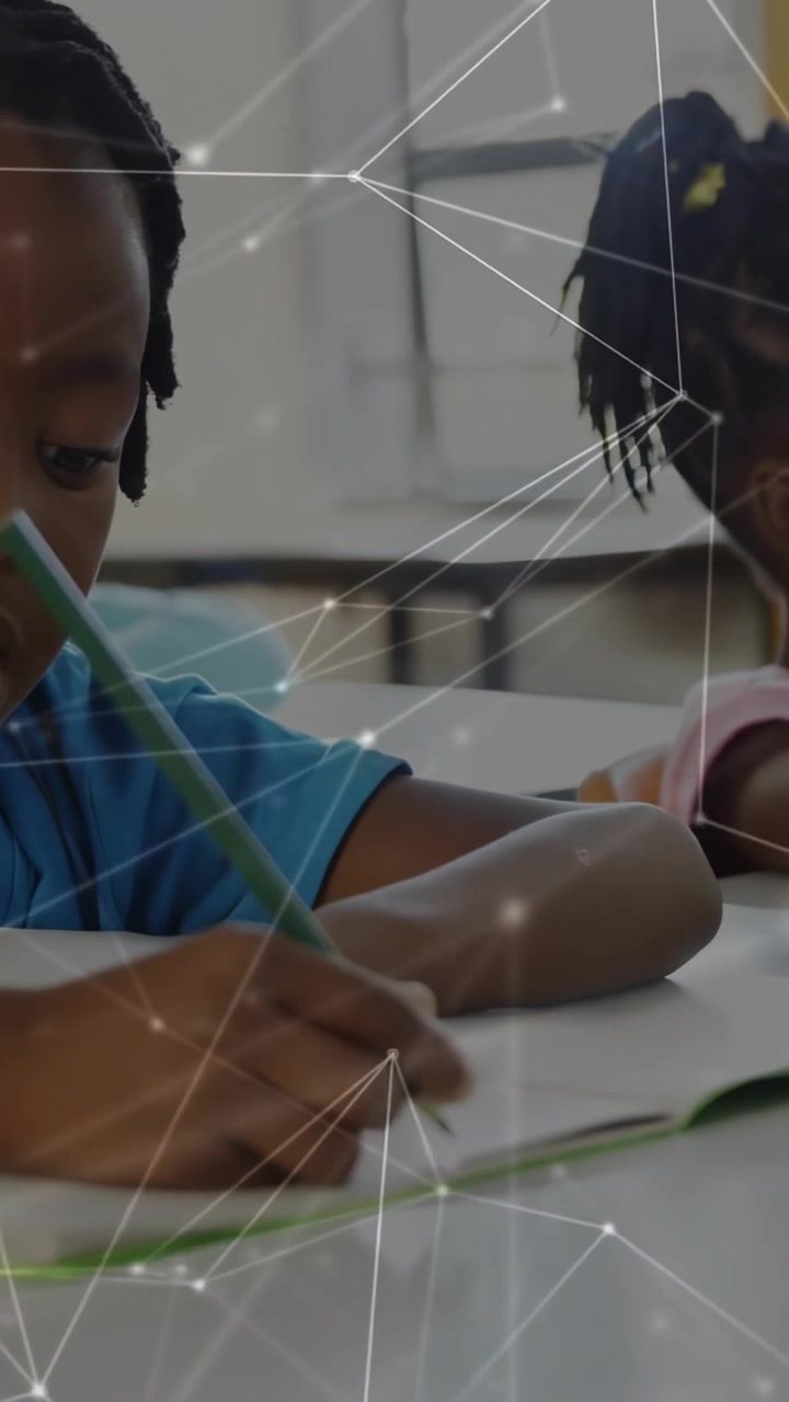 Left boy placing green pencil on page, classmates writing workbook as overlay crossing over pages