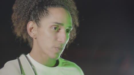 closeup shot of young man's face moving outdoors in late evening