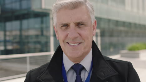 portrait of successful senior businessman ceo smiling confident at camera wearing suit in urban office building background