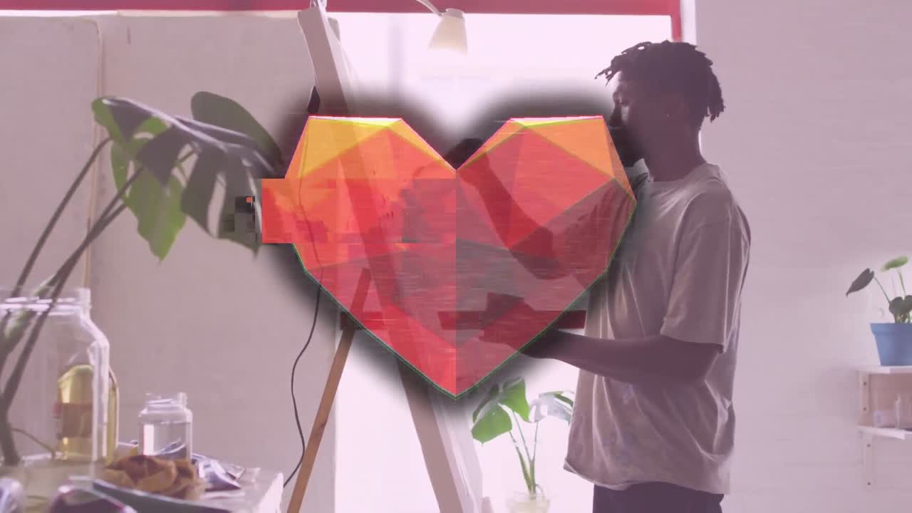 Animation of interference and heart over african american man painting