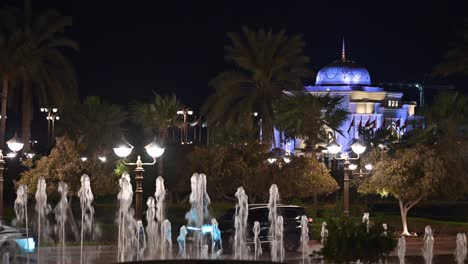 majestic palace at night with fountains