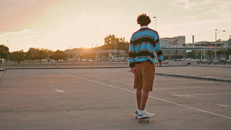 professional skater riding at sunset. active sportsman enjoying speed vertically