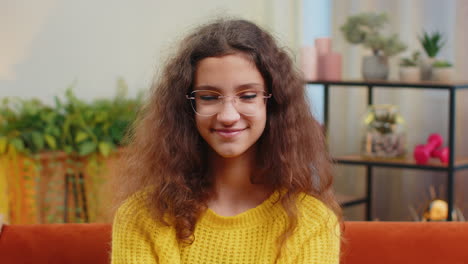 Portrait-of-happy-smiling-Caucasian-15-years-school-girl-child-kid-looking-at-camera,-home-play-room