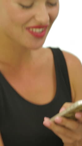 woman with smartphone. young smiling woman texting message on smartphone