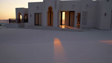 modern arabian villa at sunset in the desert