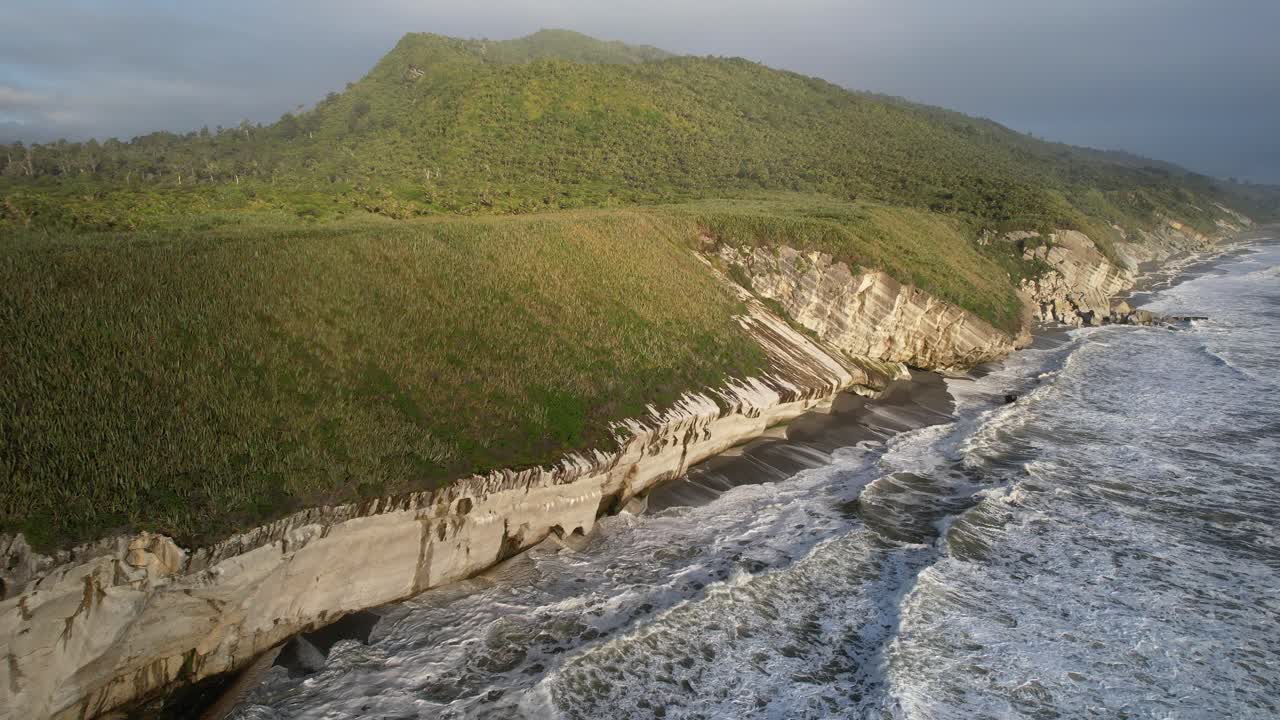 Waves Splashing Against Ocean Cliffs In Rapahoe, South Island, New Zealand - Drone Shot