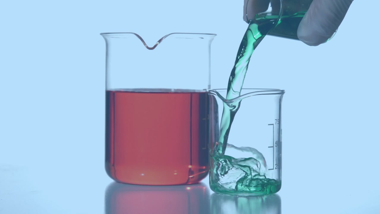 Animation of red shapes over hand of lab worker pouring reagent into glass on blue background
