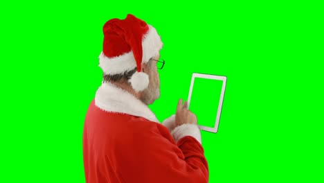 Santa-claus-using-digital-tablet