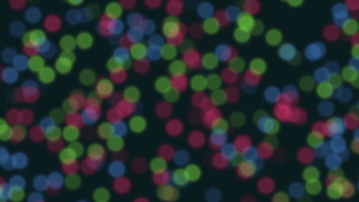 Glitter e bokeh arcobaleno su spazio scuro