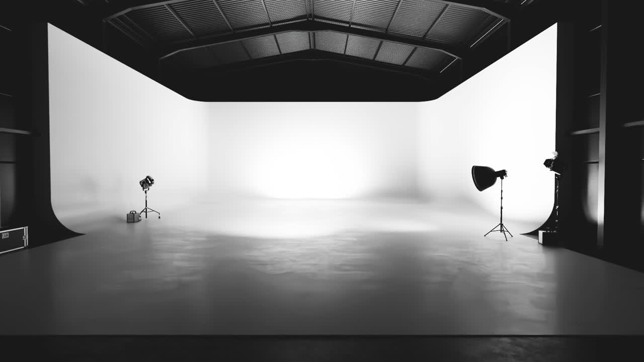Empty Professional Photography Studio with White Cyclorama and Lights
