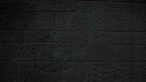 animation of glowing neon bird icon on brick wall