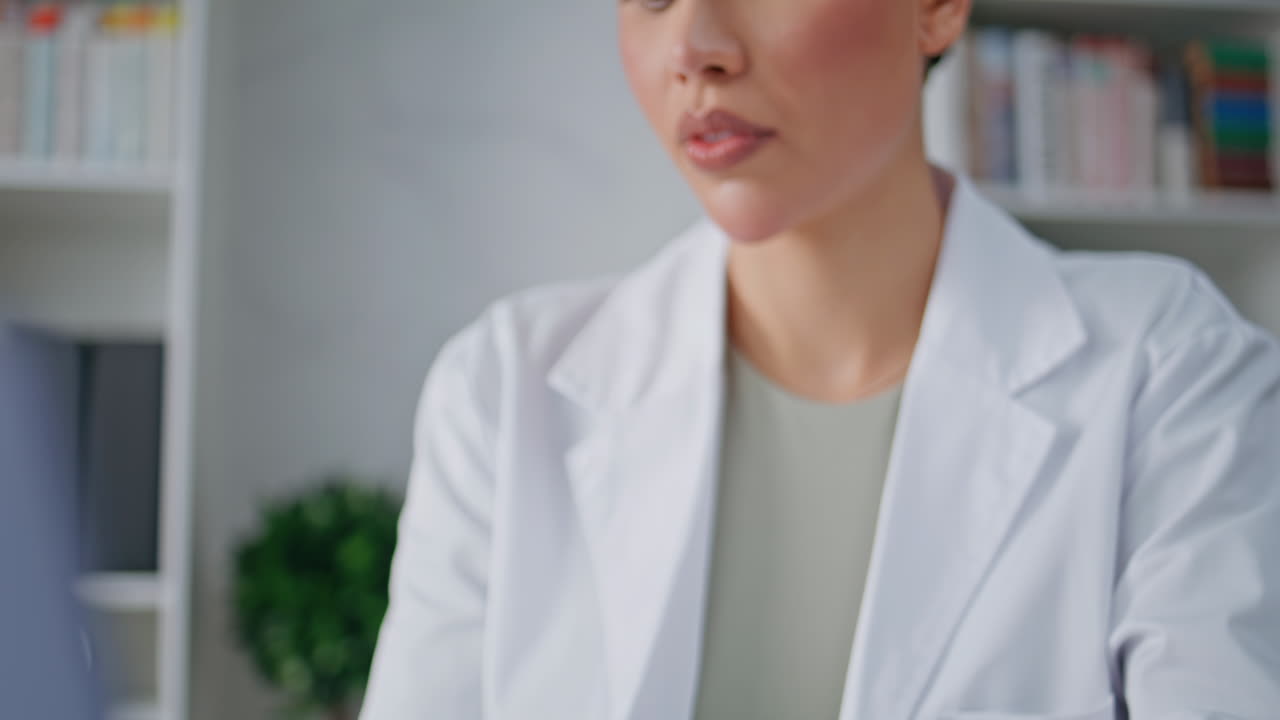 Therapist hands entering data in laptop sitting clinic closeup. Woman doctor