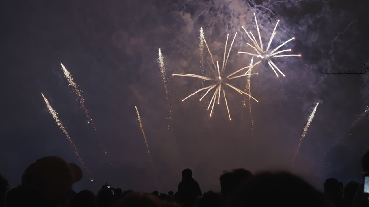 Celebration of sparkling fireworks captured on cell phones