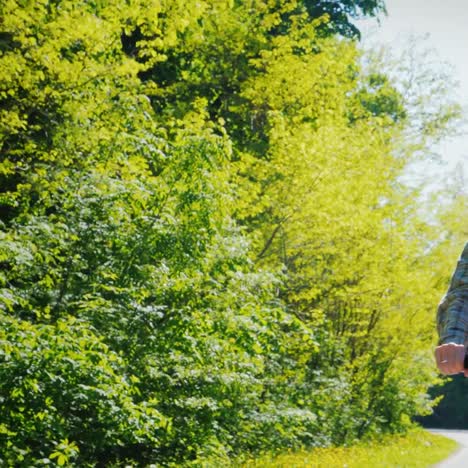 A-Young-Man-Rides-A-Bicycle-In-A-Picturesque-Place