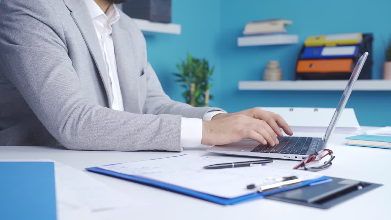 Thoughtful businessman working on laptop, executing strategy, thinking idea.