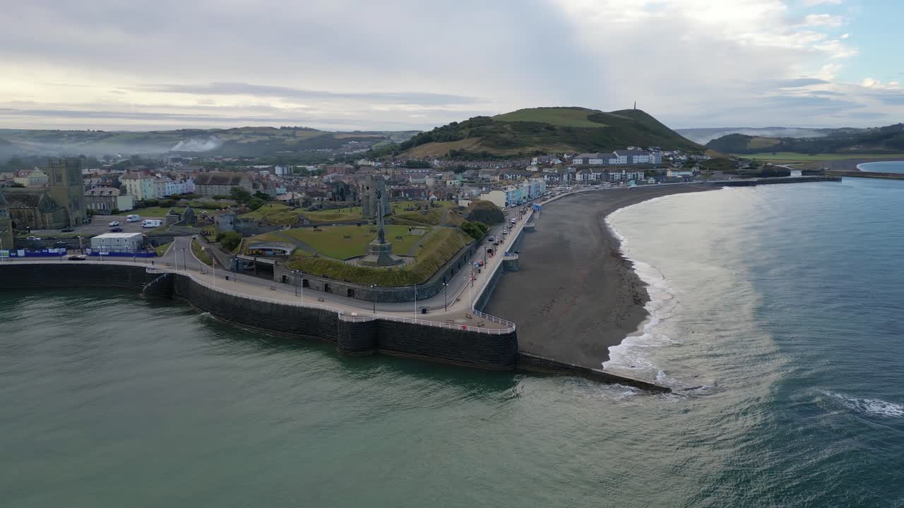 Drone footage on a summer day in UK Wales Aberystwyth around the beach, harbour, sea side, clif and town front-20