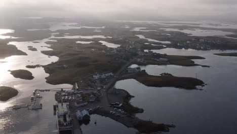 Golden-hour-drone-shot-of-Lochmaddy,-showing-the-Lochmaddy-to-Uig-ferry-run-by-Caledonian-Macbrayne