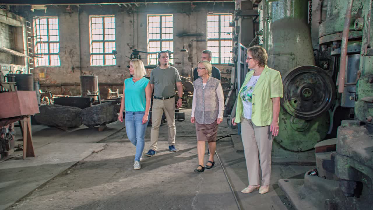 group of people in a guided visit to the Ironmaking Museum, Ravne na Koroskem