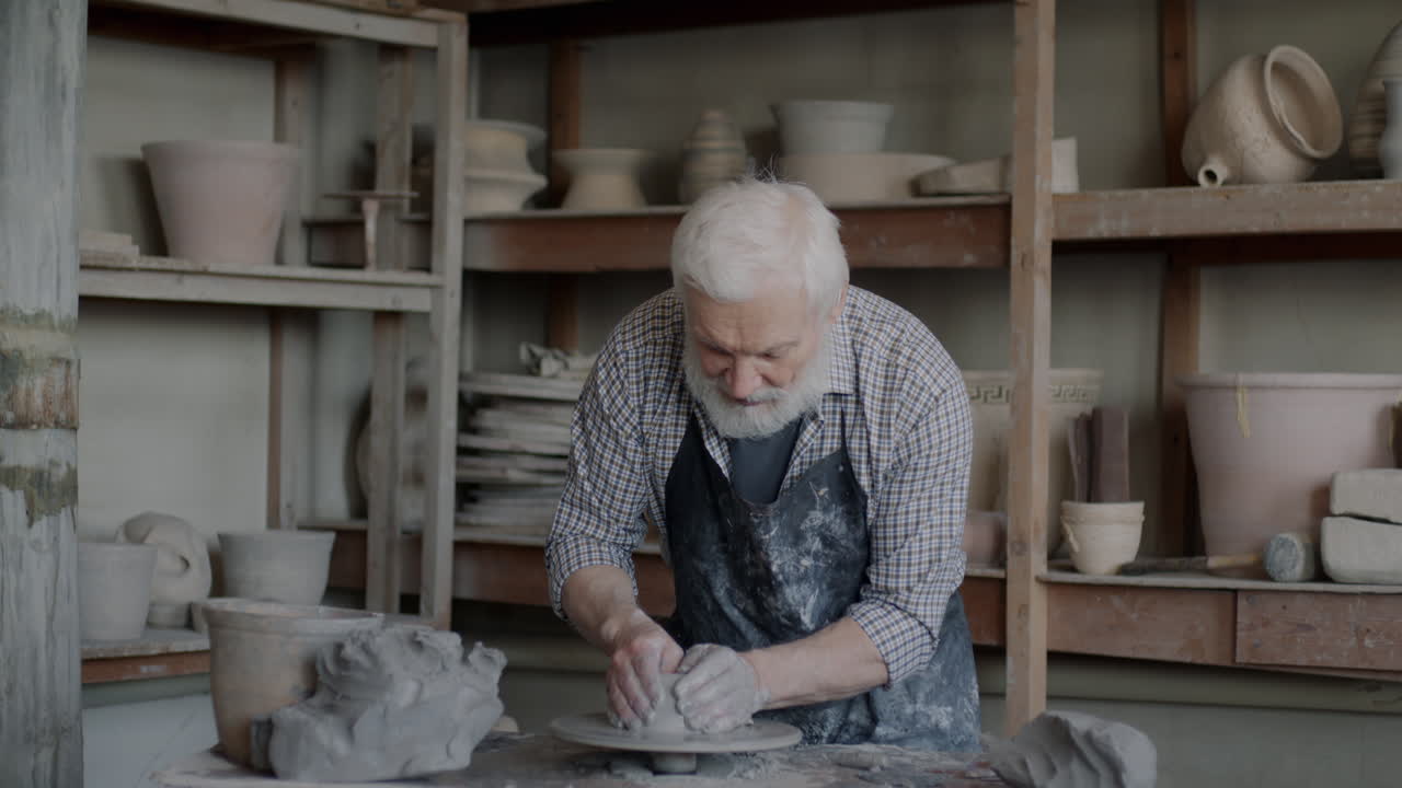 Senior Potter at Work in Studio