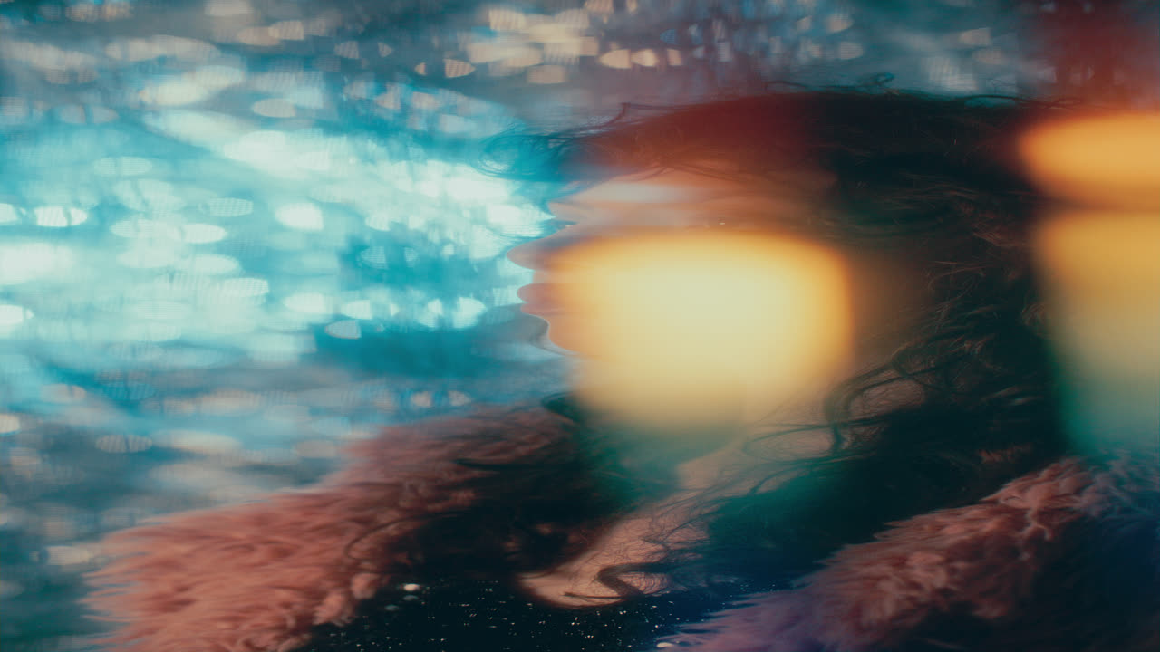 Dreamy Girl Looking Sideways in front of Sparkling Backdrop