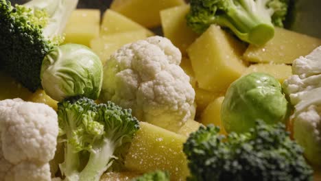 cauliflower, broccoli, brussels sprouts, potatoes seasoned with salt and pepper