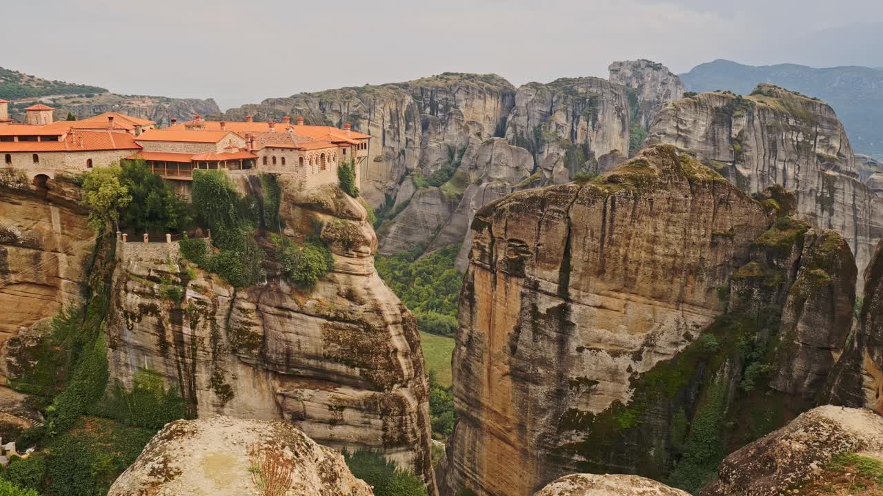 Greek monastery Varlaam on top of dramatic vertical cliff Meteora