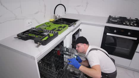 top view of a master installing furniture and appliances in a kitchen room