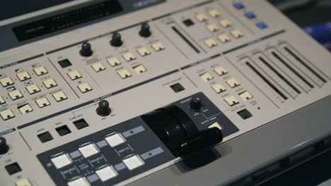 hand operating a professional video mixer