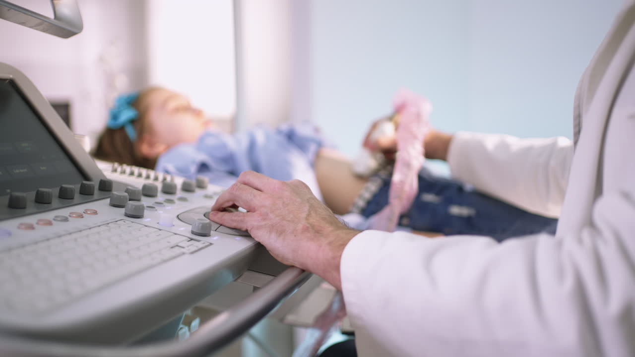 Doctor performing an ultrasound examination on a child