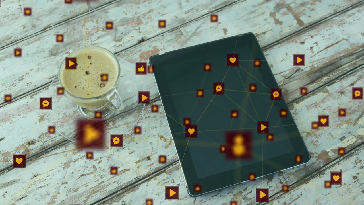 animación de una red de iconos digitales contra una tableta digital y una taza de café en una superficie de madera.