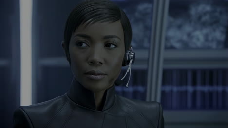woman with headset in control room