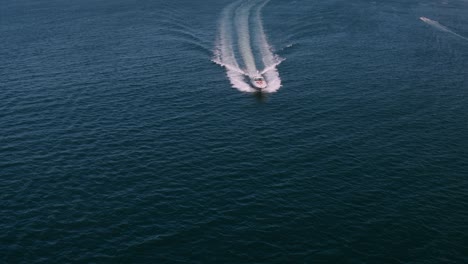 private yacht sailing in sea with people on deck